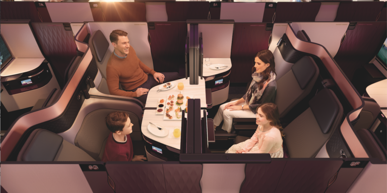 The unique Qsuite business class. Four seats are arranged together, which can be kept separate, or with the simple slide of panels, two, three or all four of the suites can be converted into an open area for a family or other traveling group to dine together. Double beds can also be deployed