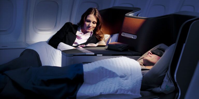 lufthansa business class man and woman in bed