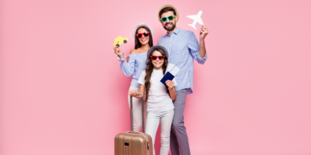 a happy family with a suitcase