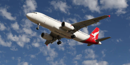 A QantasLink Airbus A320 plane flying in the sky