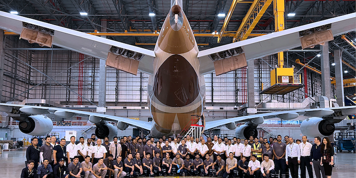 The Etihad Engineering team standing with the a380 in the hangar