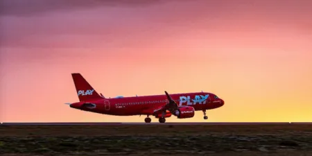 a play airlines airbus a320 landing on a runway