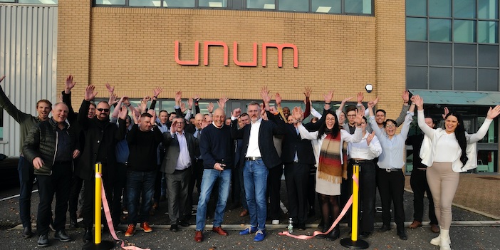 A crowd attends the ribbon-cutting ceremony for the opening of Unum Aircraft Seating's new facility in Crawley, UK