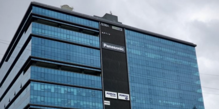 Panasonic Avionics' IFEC software design facility in Pune, India. A glass building around 10 floors high