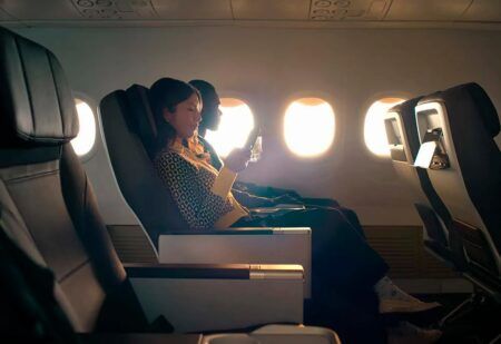 A female passenger relaxing in an Alaska Airlines first class seat