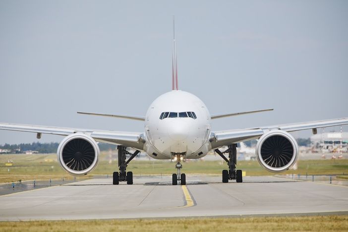 a narrowbody plane on an airport runway