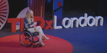 Sophie Morgan on stage in a wheelchair giving a Ted X Talk in London