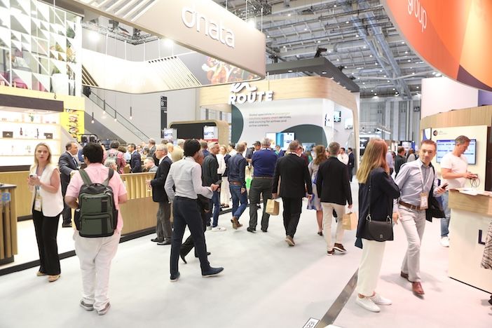 People walking around the show floor of the 2024 WTCE event