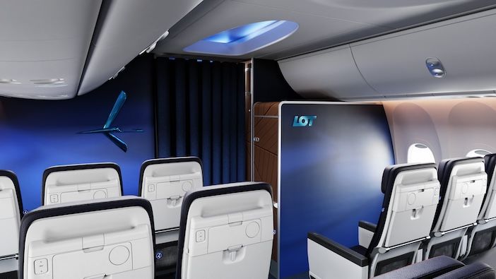 A rear view of a LOT boeing 737 cabin fitted with dark blue recaro R2 economy class seats