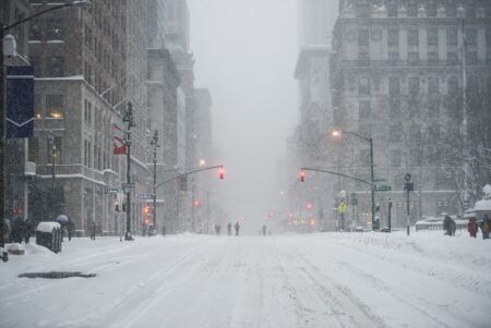The USA’s snowstorms have exposed airline vulnerabilities New York City Manhattan Midtown street under the snow during snow blizzard in winter. Empty 5th avenue with no traffic.