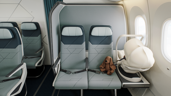 The Collins Aerospace SkyNook, with two economy seats next to each other, and a small table are to the window side holding a baby carrier