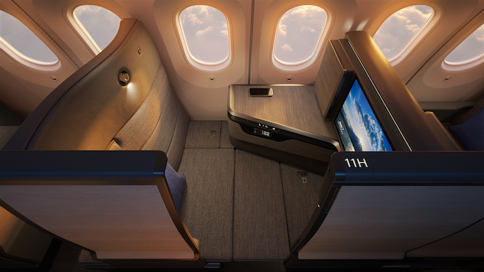 ANA's THE Room FX business-class suite for the Boeing 787-9, with warm light coming through the aircraft cabin windows