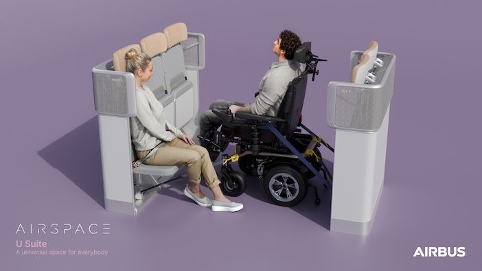 A female passenger sitting in the nearest of three jumpseat-style seats, diagonally opposite a male passenger with his wheelchair secured to the two folded jumpseats opposite