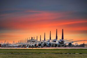 Airplanes are parking at maintenance area, Comercial airplane docking in terminal in the parking lot of the airport waiting for services maintenance, refilling fuel services.