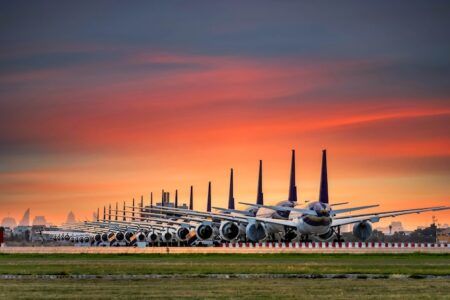 Airplanes are parking at maintenance area, Comercial airplane docking in terminal in the parking lot of the airport waiting for services maintenance, refilling fuel services.