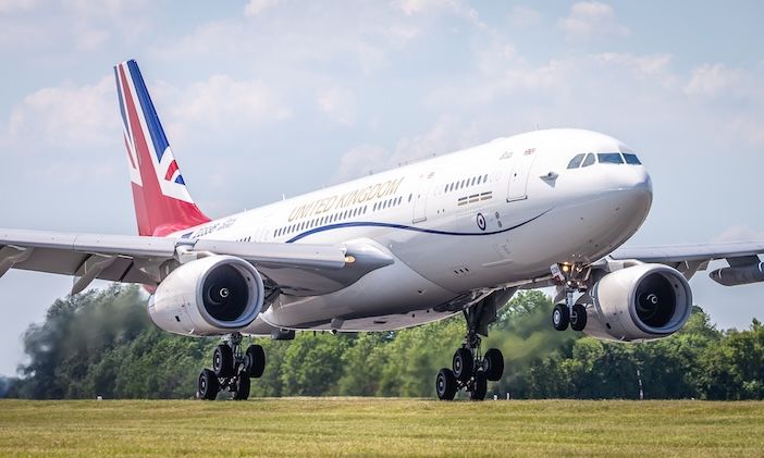 Image shows ZZ336, the RAF's VIP Voyager (Vespina), landing and taxiing into RAF Brize Norton. The white plane has a union flag on the tail, and United Kingdom across the side