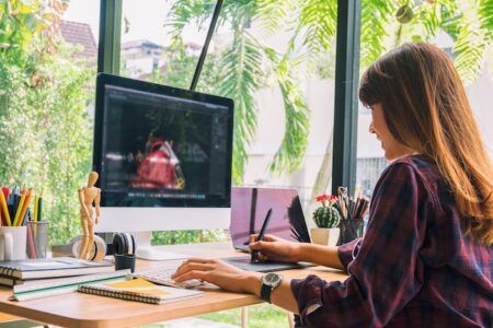 The value of the UK’s design sector has overtaken retail and hospitality Graphic designers work with computer and mouse pen design products and websites, Graphic designers concept